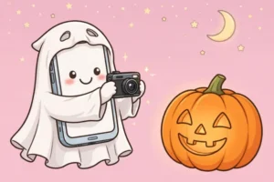 Cartoon illustration for Halloween night phone tips: a smiling smartphone in a tiny ghost costume photographing a glowing jack-o-lantern under a crescent moon, on a soft pink background